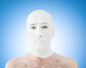 Artistic painting man face in white