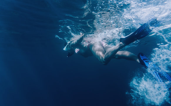 Woman freediver swimming in the sea