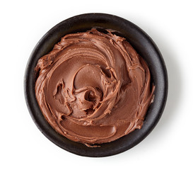 Chocolate cream in round dish isolated on white background
