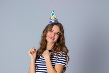 Smiling woman in celebration cap