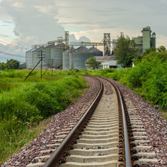 Fototapeta premium Railroad to industrial factory buildings