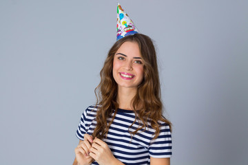 Smiling woman in celebration cap