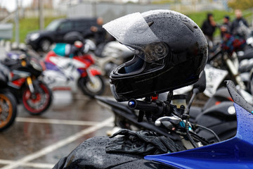 Moto helmet on motorcycle handlebars