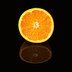 Orange slice isolated on a black