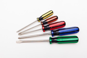colorful screwdrivers on white backgrounds