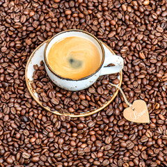 Cup coffee beans paper heart. Love concept