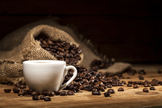 Coffee beans on wooden background