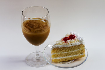 white cake and coffee  on table