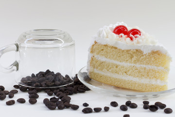 white cake and coffee beans on table