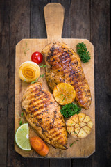 Grilled chicken breast on the cutting board