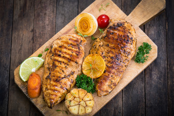 Grilled chicken breast on the cutting board