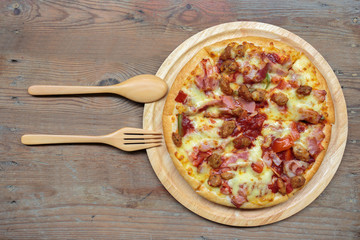 Pizza on a wooden tray.