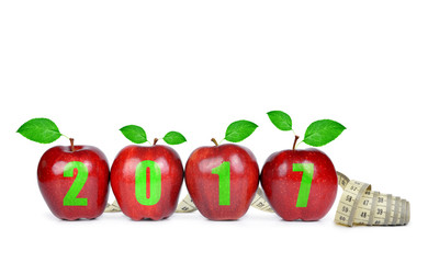 Red apples with measuring tape. Healthy resolutions for the New Year 2017