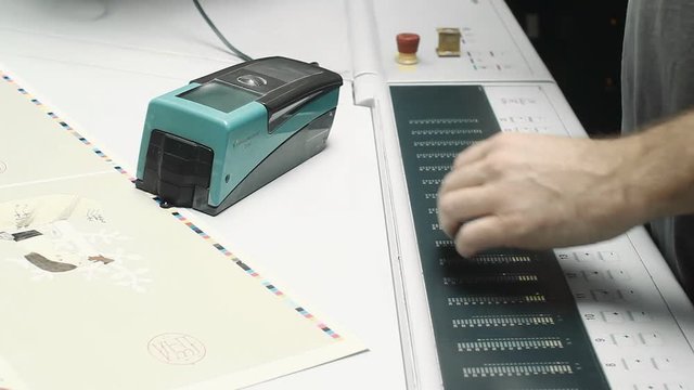 Man Working With Apprentice in Printing House