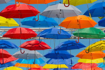 Street decorated with colored umbrellas close up