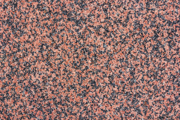 Red granite mineral flat surface texture.
