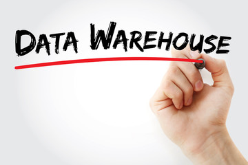 Hand writing data warehouse with marker, concept background