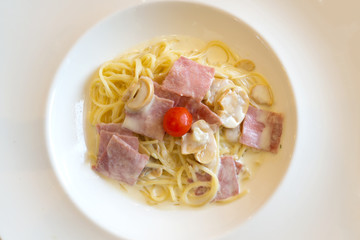 Spaghetti Carbonara with bacon ham Italian food in white dish.