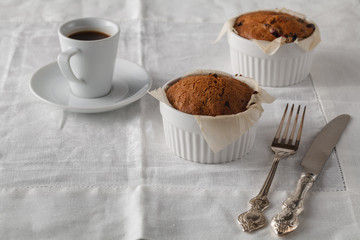 Bran muffins with raisins and a cup of coffee