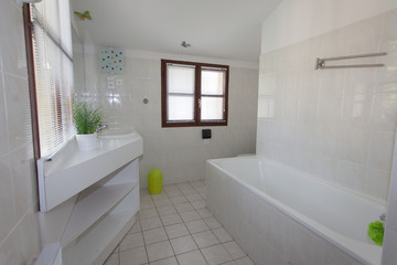 Naklejka na ściany i meble Modern white Bathroom interior in a bright house