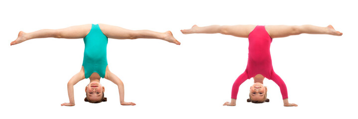 Flexible kids gymnasts standing on head, isolated white background