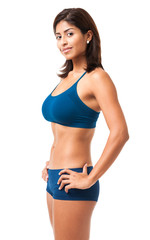 Obraz premium Young Hispanic Fitness Exercising Woman isolated on white background