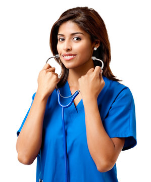 Attractive Young Female Woman Latin Hispanic Doctor Nurse Practitioner In Blue Scrubs With Stethoscope Isolated On White Background