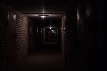 Dark long corridor hallway in a basement