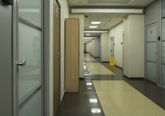 Empty long office corridor during quarantine