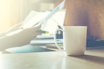 Mug coffee on table in the room.