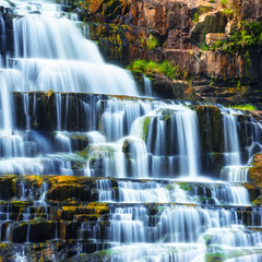 Tropical rainforest landscape with flowing Pongour waterfall. Da Lat, Vietnam