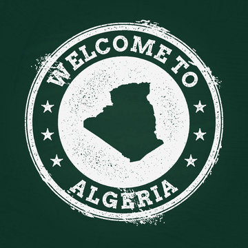 White chalk texture retro stamp with People's Democratic Republic of Algeria map on a green blackboard. Grunge rubber seal with country outlines, vector illustration.