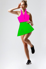 Attractive girl covering fake t-shirt and skirt over white background.