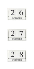 Closeup group of white wooden calendar with black 26 , 27 , 28 october word , three date calendar isolated on white background