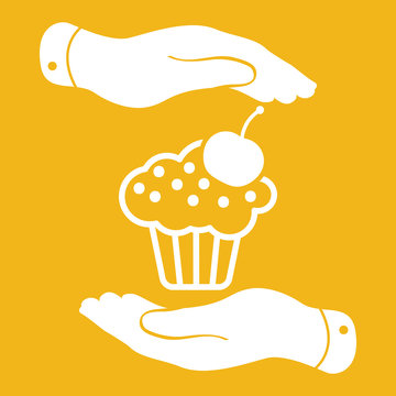 two hands with badge with white cake icon and cherry on yellow b