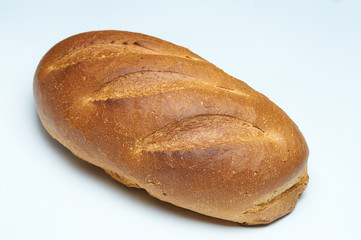 A loaf of fresh bread, isolate on a white background. Bread with a crispy crust.