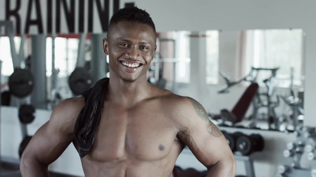 Fitness man laughing in gym