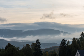Summer landscape in mountains and the dark blue sky with clouds