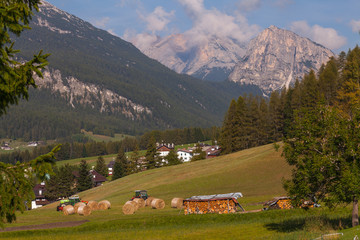 Fototapeta na wymiar Farmers work in Cortina d'Ampezzo, Italy
