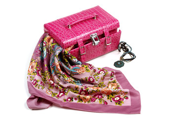 Pink leather jewelry box with satin kerchief on white background