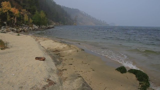 The rustle of the waves rolled on shore. Lake Baikal, Buryatia, Russia.