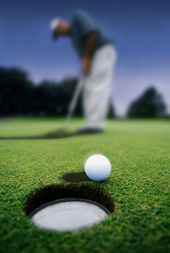 Golf ball near a hole