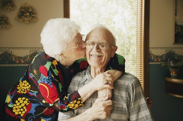 Woman Kissing Her Husband