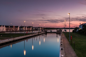Obraz premium Sunset at the locks of Spaarndam, The Netherlands.