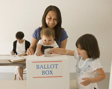 Woman Voting With Kids