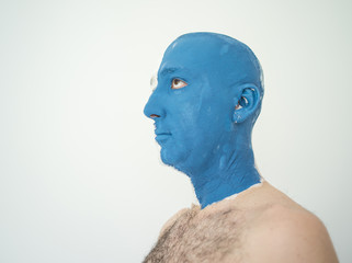 Blue and white face portait photo of a man