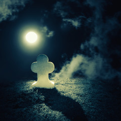 Dark night spooky landscape with abandoned grave and memory stone on lonely haunted planet under...