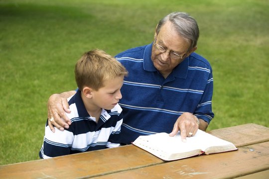 Grandpa And Grandson Reading The Bible