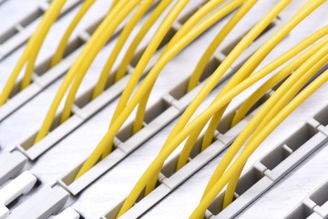 Telecommunication main distribution frame with colorful cables, close up