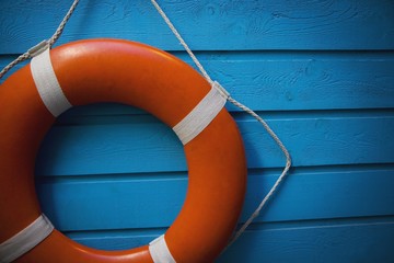A Life Preserver Hanging On A Blue Wall